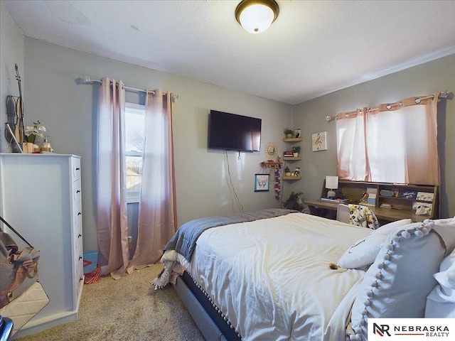 carpeted bedroom with a textured ceiling