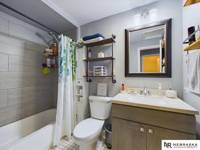 full bathroom featuring tile patterned floors, a textured ceiling, vanity, shower / tub combo with curtain, and toilet