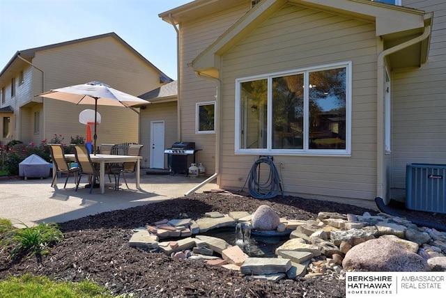 back of house featuring central AC and a patio area