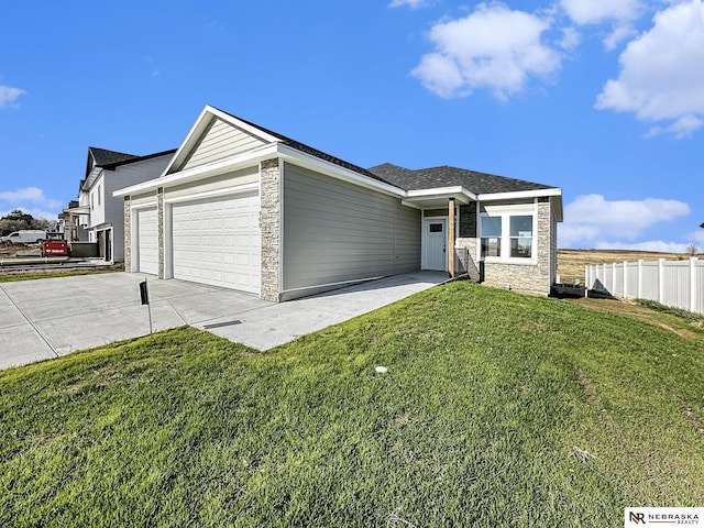 single story home with a garage and a front yard