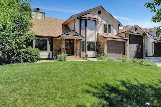 view of front facade featuring a garage and a front lawn