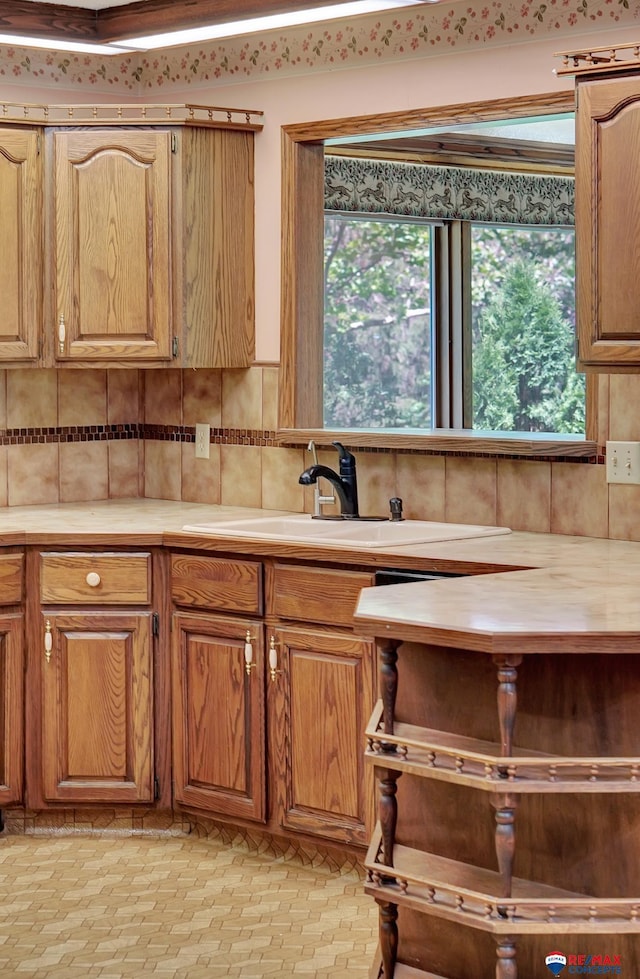 kitchen with sink and tasteful backsplash