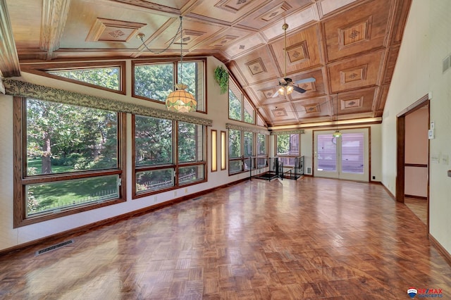 unfurnished sunroom with coffered ceiling, ceiling fan, a healthy amount of sunlight, and vaulted ceiling