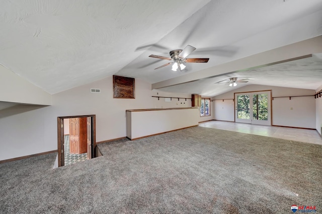 bonus room featuring a textured ceiling, ceiling fan, light colored carpet, and lofted ceiling