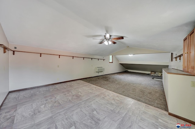 bonus room featuring heating unit, ceiling fan, light carpet, and lofted ceiling