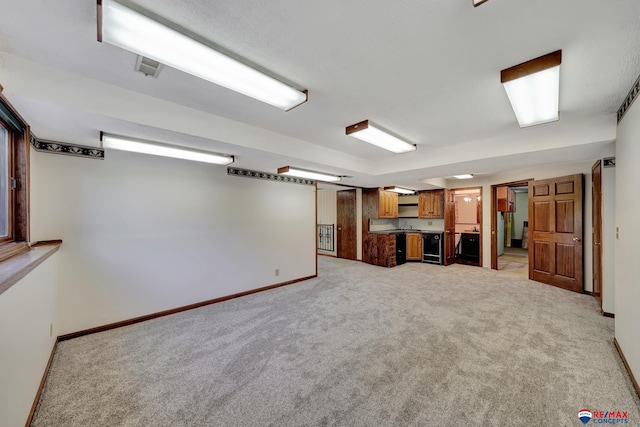 basement with light colored carpet