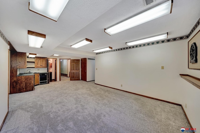 interior space with wine cooler, sink, and light colored carpet