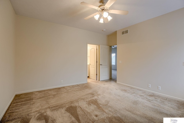 unfurnished room featuring light carpet and ceiling fan