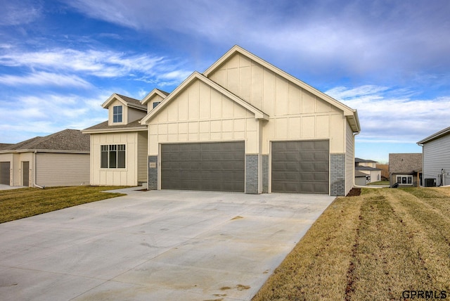 view of front facade featuring a garage and a front lawn