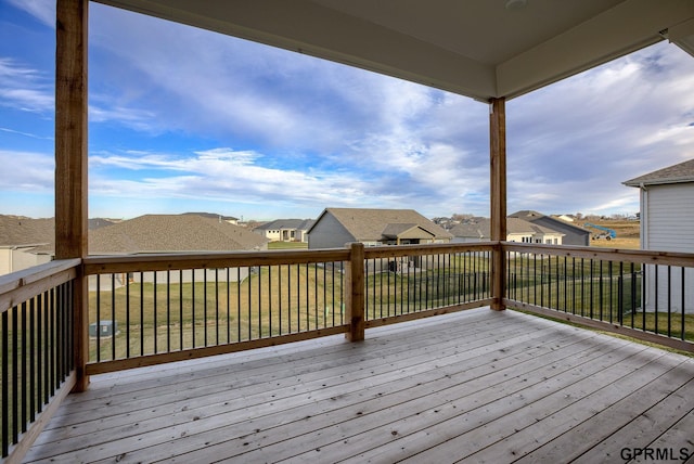 wooden deck featuring a yard