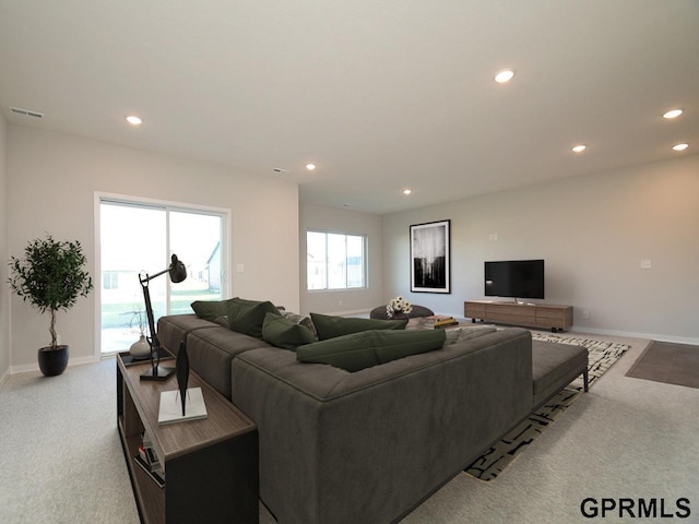 living room featuring light carpet