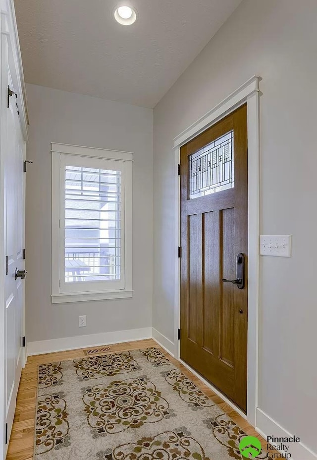 foyer with light hardwood / wood-style flooring