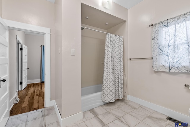 bathroom featuring shower / bath combination with curtain