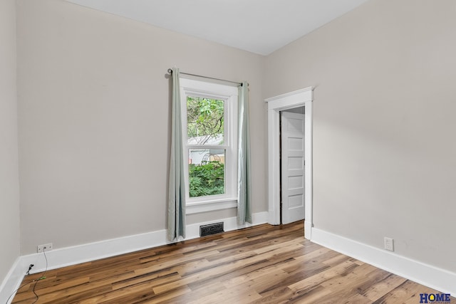 spare room with light hardwood / wood-style flooring