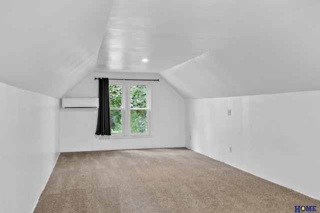 bonus room featuring carpet, vaulted ceiling, and a wall mounted AC