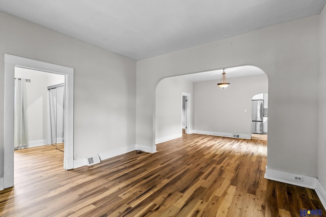 empty room featuring hardwood / wood-style floors