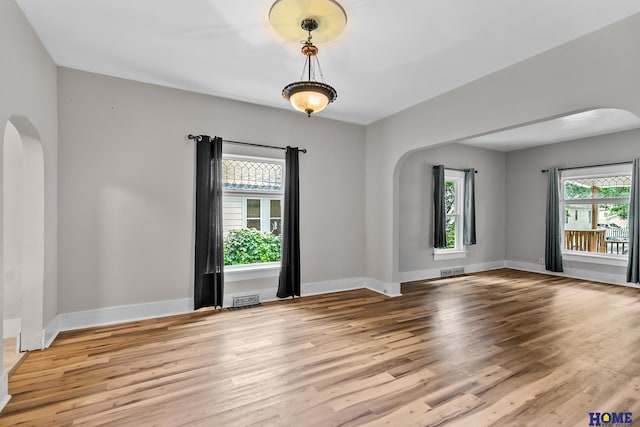 unfurnished room featuring light hardwood / wood-style floors