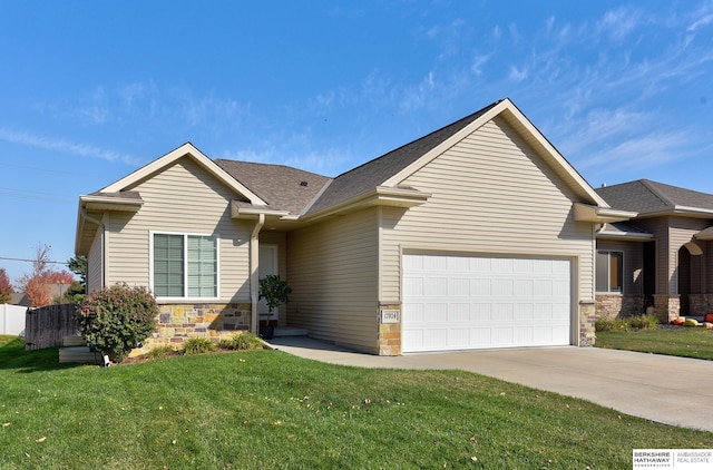 view of front of property featuring a garage and a front lawn