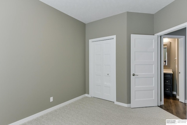 unfurnished bedroom with carpet and a closet