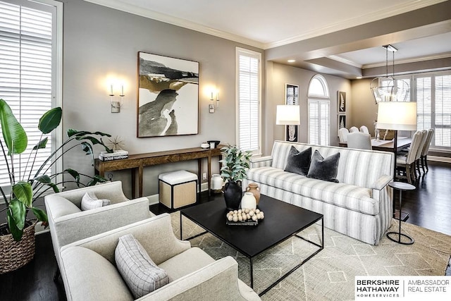 living room featuring hardwood / wood-style floors, a wealth of natural light, and ornamental molding