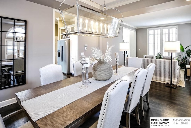 dining room featuring a chandelier, dark hardwood / wood-style flooring, and ornamental molding