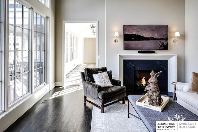 living area with hardwood / wood-style floors