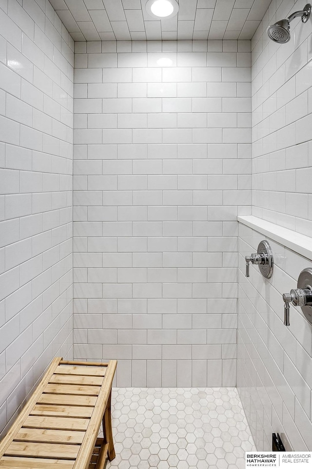 bathroom with a tile shower