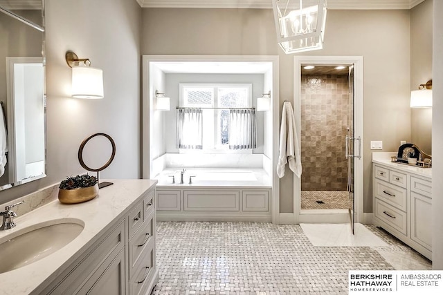 bathroom featuring vanity, an inviting chandelier, tile patterned floors, crown molding, and separate shower and tub