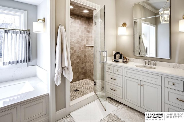 bathroom featuring vanity, an enclosed shower, and crown molding