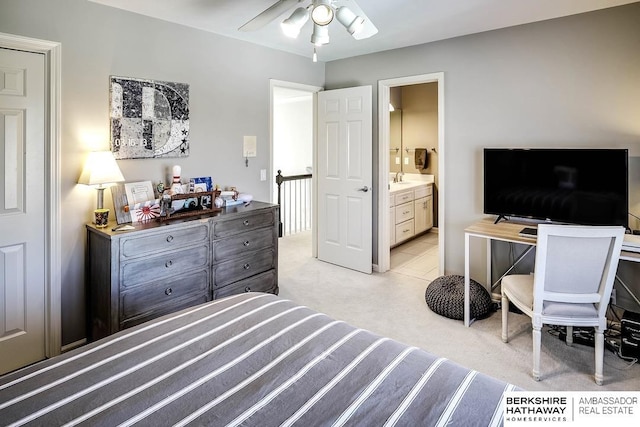 carpeted bedroom featuring ceiling fan and connected bathroom