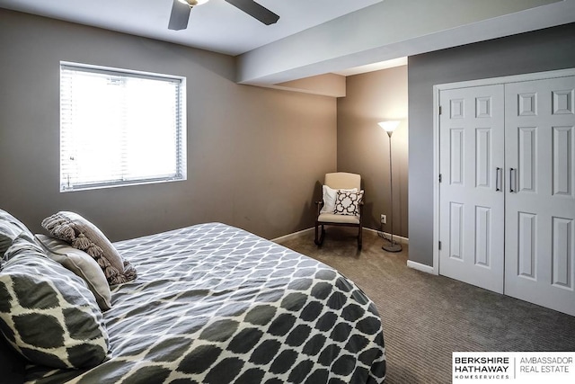 carpeted bedroom featuring ceiling fan and a closet