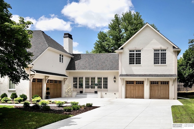 view of front of property with french doors and a garage