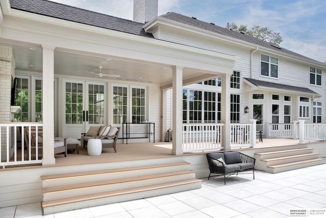 back of house with an outdoor living space and ceiling fan