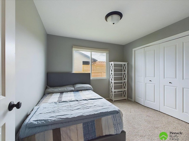 carpeted bedroom featuring a closet