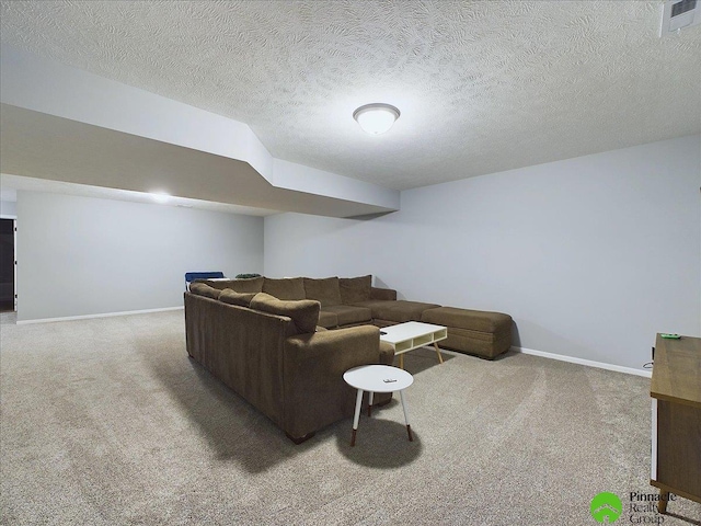 carpeted living room featuring a textured ceiling