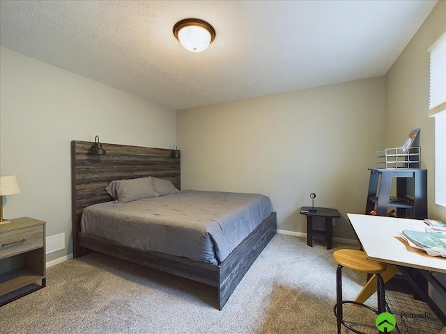 carpeted bedroom with a textured ceiling