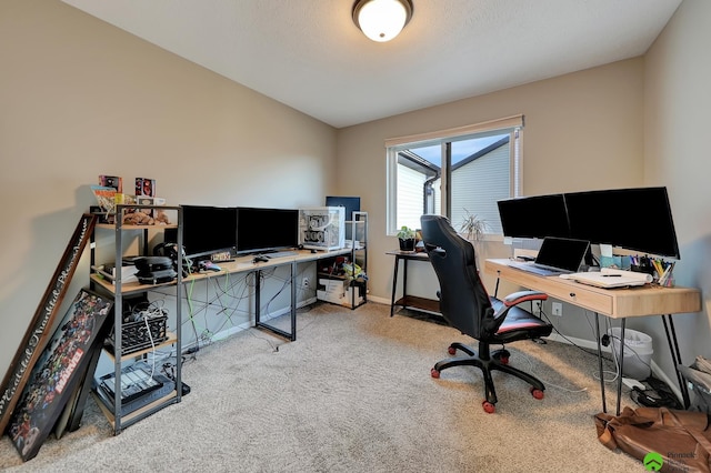 home office with baseboards and carpet floors