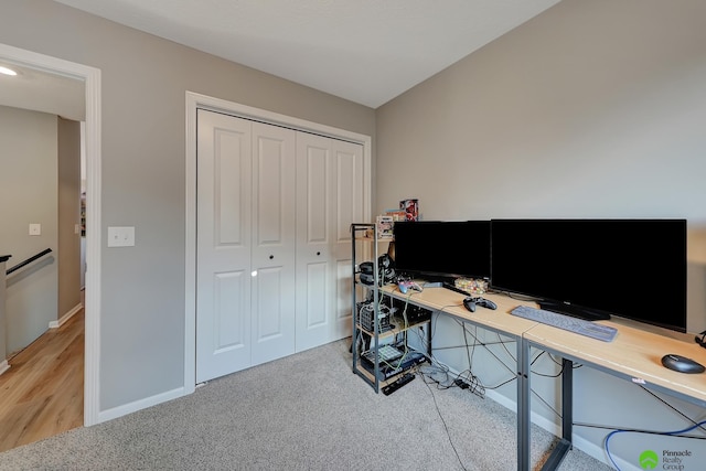 office area with carpet flooring and baseboards