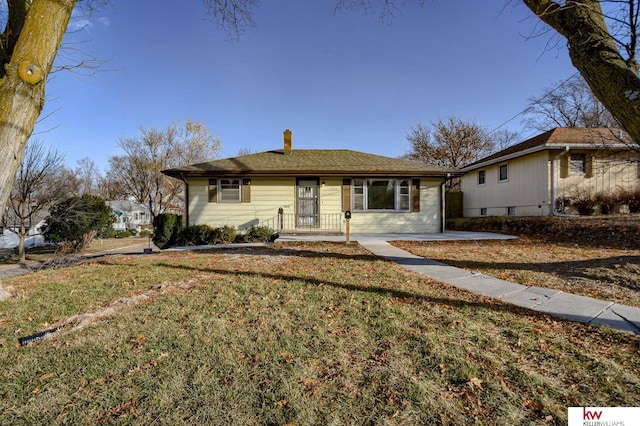 ranch-style house with a front lawn