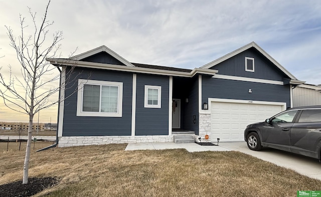 ranch-style house with a garage and a front lawn