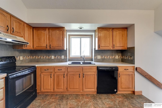 kitchen with black appliances, sink, and tasteful backsplash