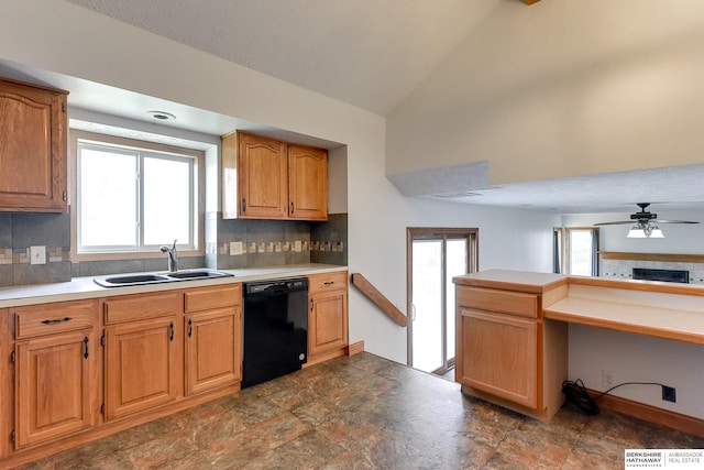 kitchen with ceiling fan, dishwasher, sink, backsplash, and lofted ceiling