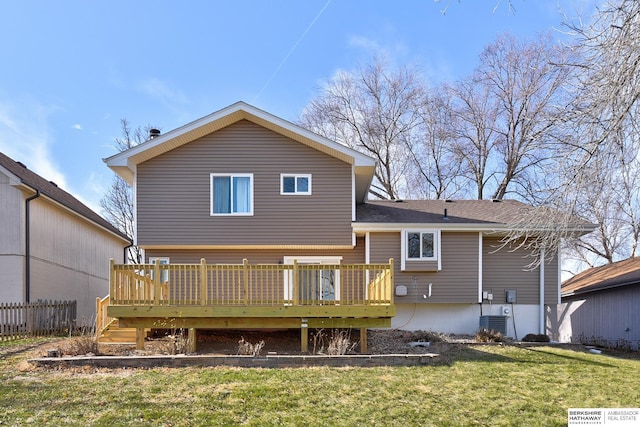 back of property featuring a deck, a yard, and central air condition unit