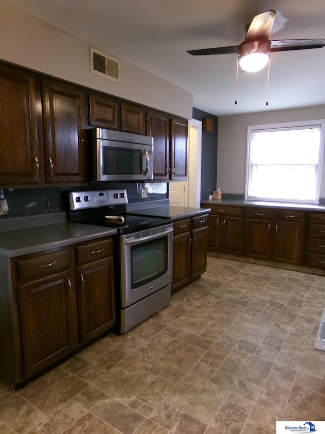 kitchen featuring dark brown cabinets, ceiling fan, and appliances with stainless steel finishes