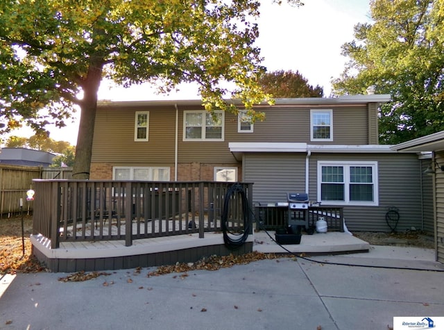 rear view of property with a wooden deck