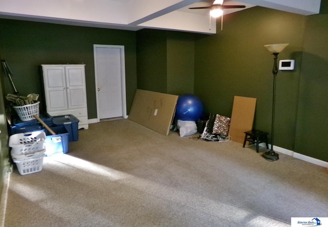 interior space featuring carpet flooring and ceiling fan