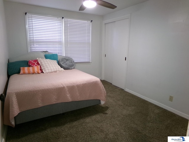 carpeted bedroom featuring a closet and ceiling fan