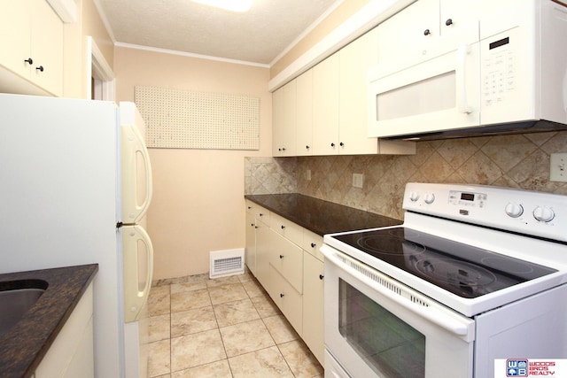 kitchen featuring decorative backsplash, white appliances, crown molding, white cabinetry, and light tile patterned flooring