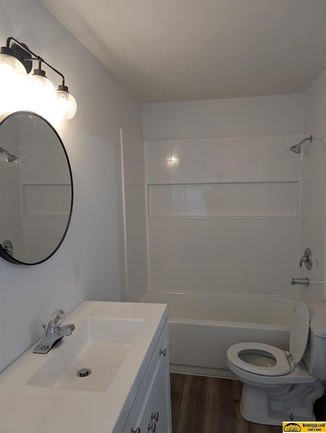 full bathroom featuring wood-type flooring, vanity, toilet, and shower / washtub combination