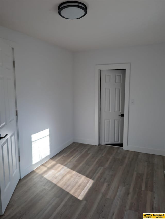 empty room featuring hardwood / wood-style flooring